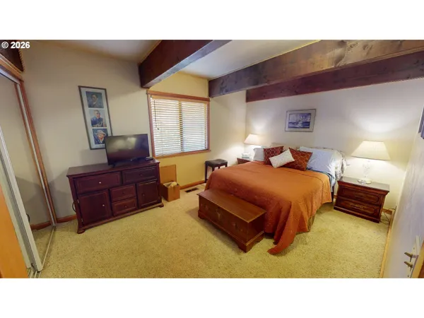 a living room with a bed and furniture