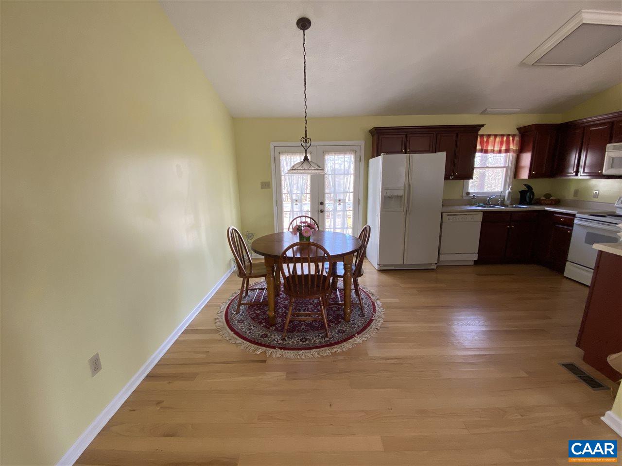 72 Tulip Road Ruckersville, VA 22968 - Photo 5 of 15 a view of a dining room with furniture window and wooden floor
