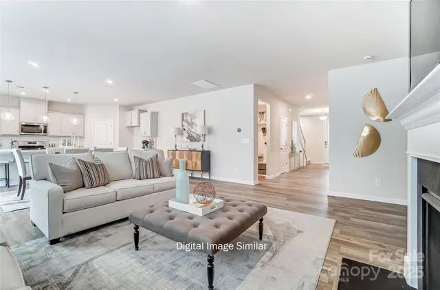 a view of kitchen with cabinets table and chairs