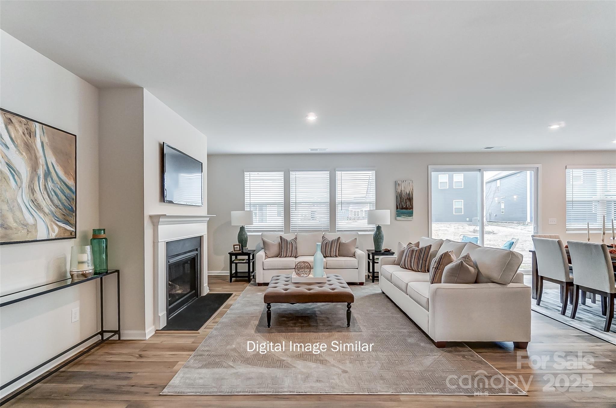 2526 Mabel Lane Monroe, NC 28110 - Photo 26 of 48 a living room with furniture fireplace and a large window