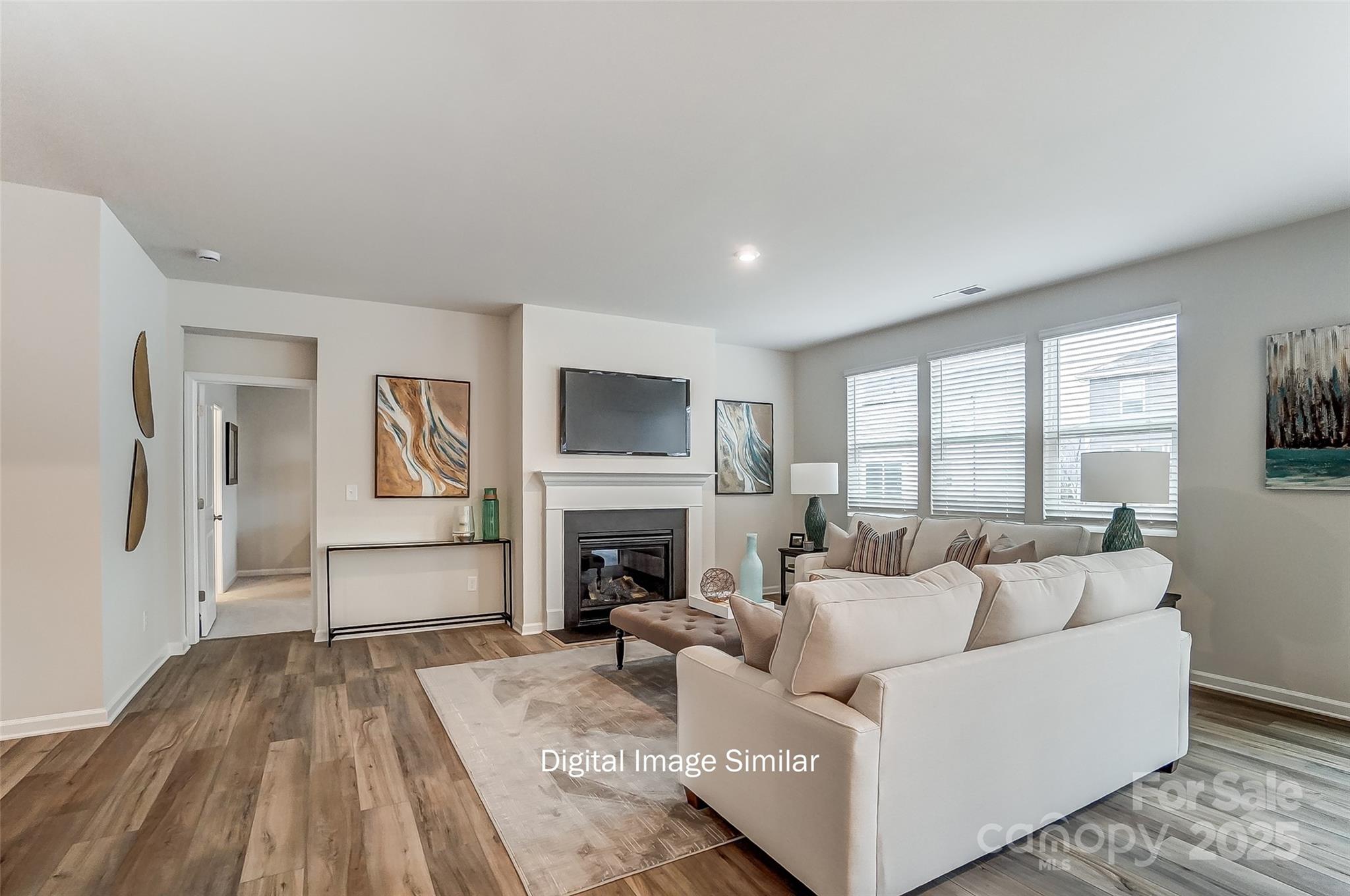 2526 Mabel Lane Monroe, NC 28110 - Photo 27 of 48 a living room with furniture and a fireplace