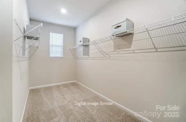 a bedroom with a bed and a fireplace