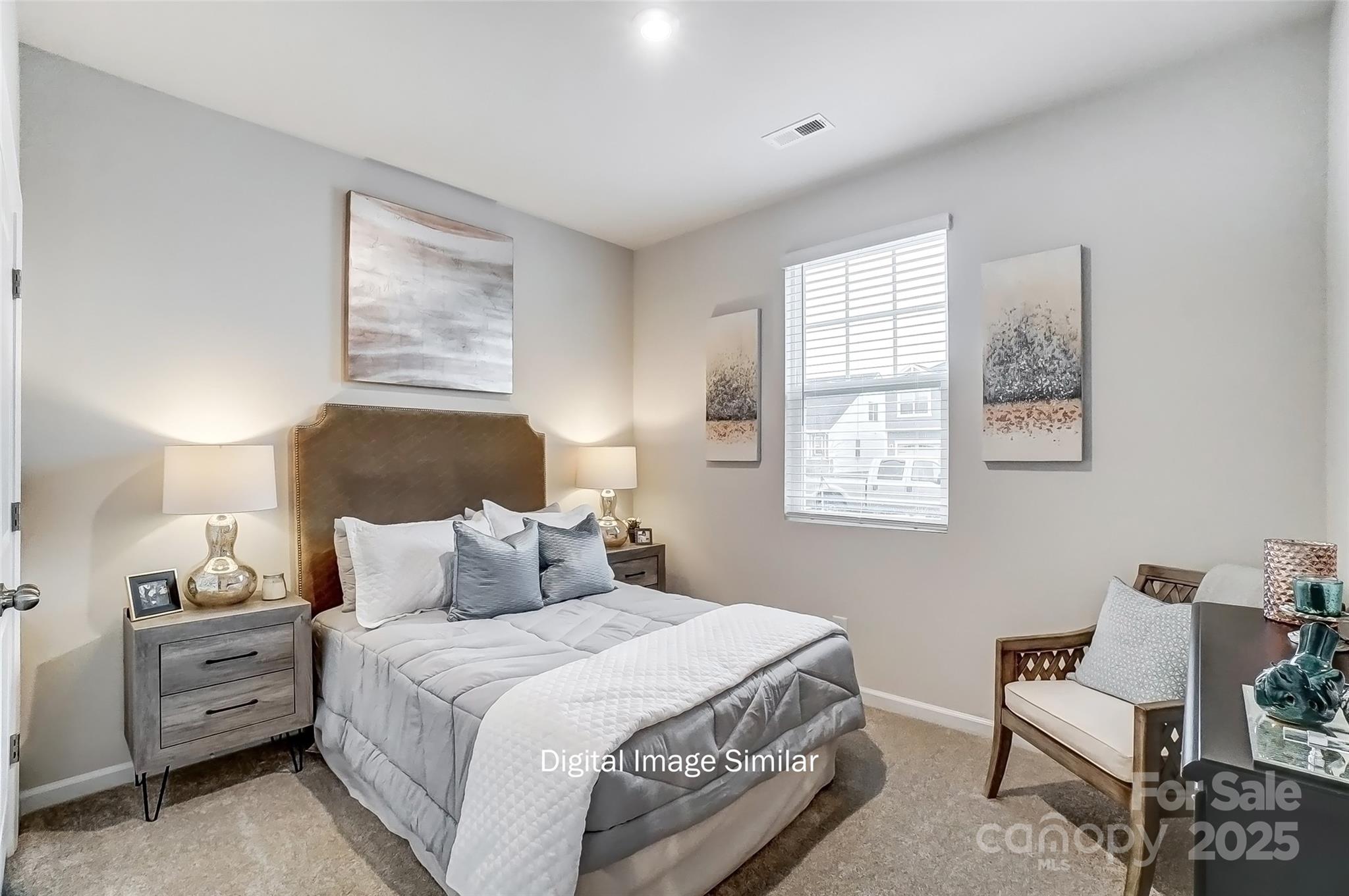 2526 Mabel Lane Monroe, NC 28110 - Photo 32 of 48 a bedroom with a bed and a lamp on dresser