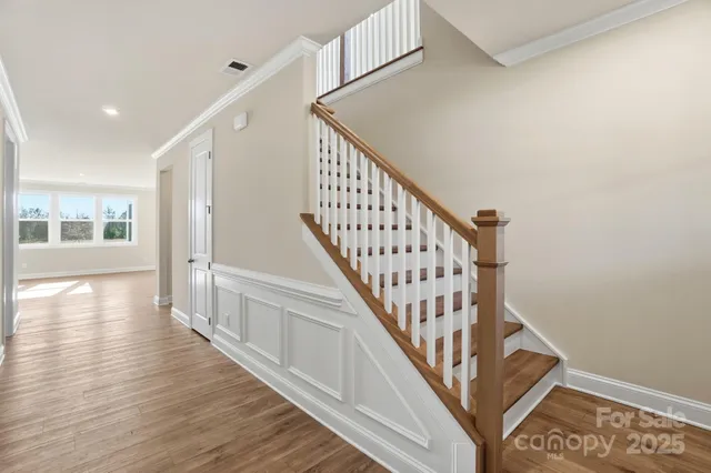 a view of kitchen living space with wooden floor