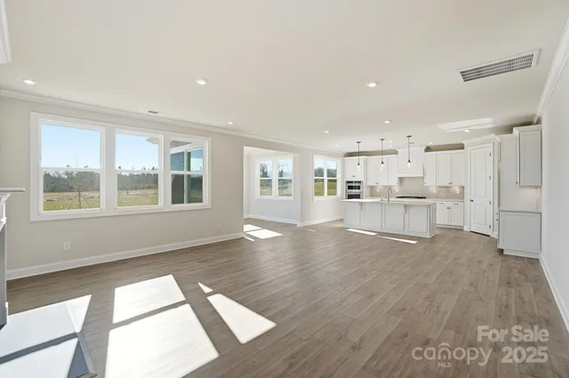 a view of kitchen with wooden floor