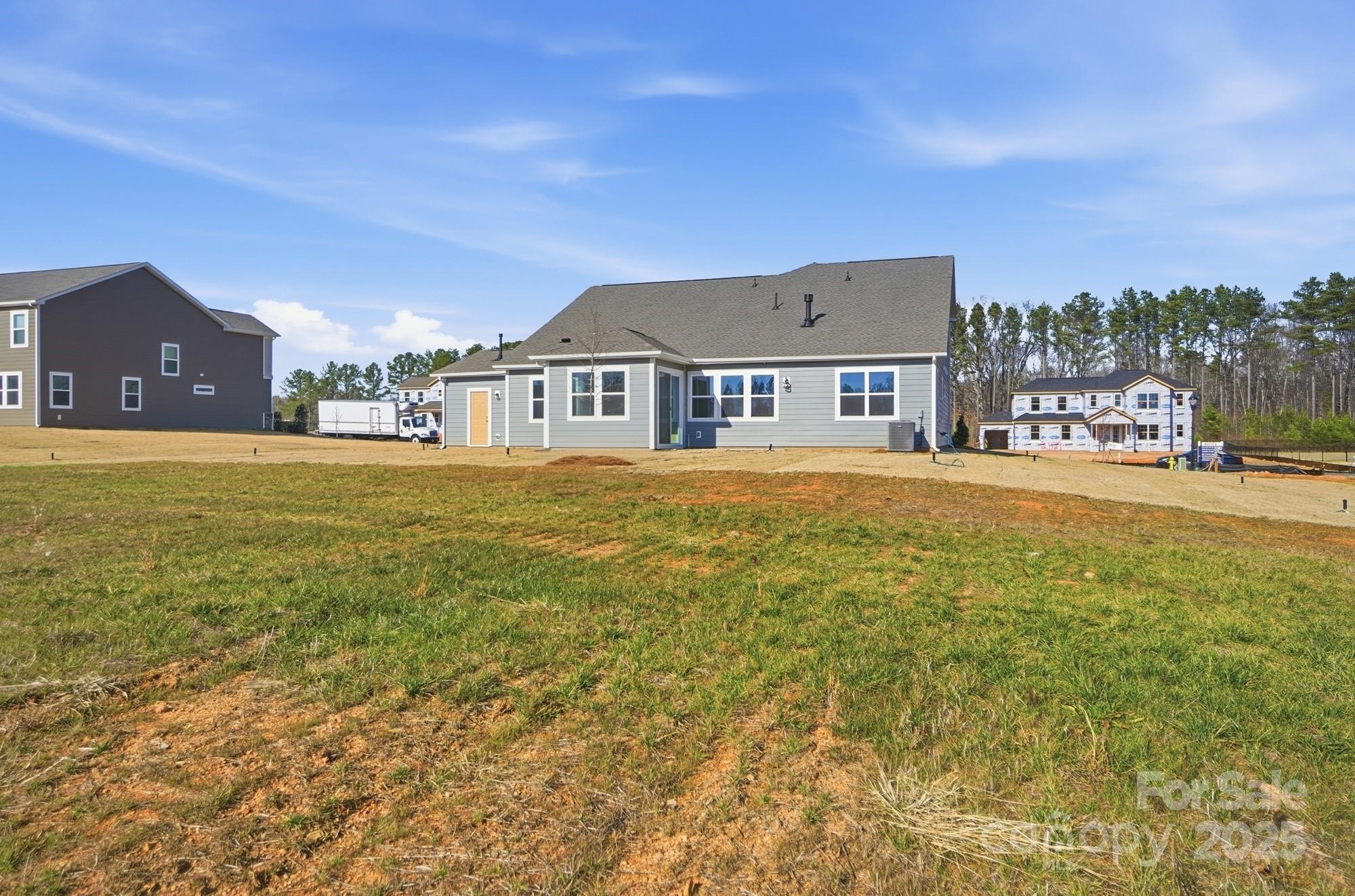 2526 Mabel Lane Monroe, NC 28110 - Photo 9 of 48 a view of a house with a big yard and large trees
