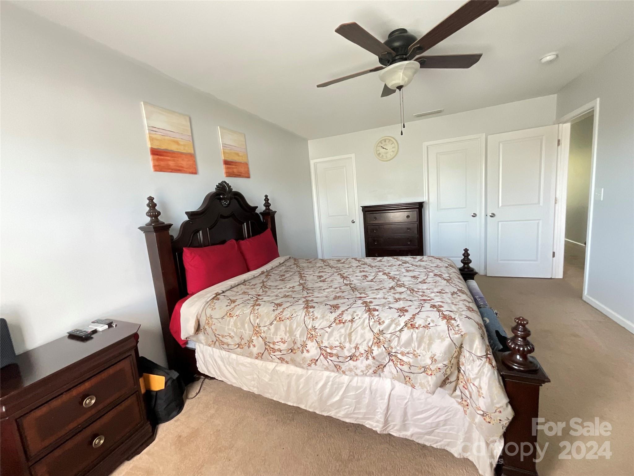 3271 Brickwood Circle Midland, NC 28107 - Photo 13 of 20 a bedroom with a bed and a chandelier