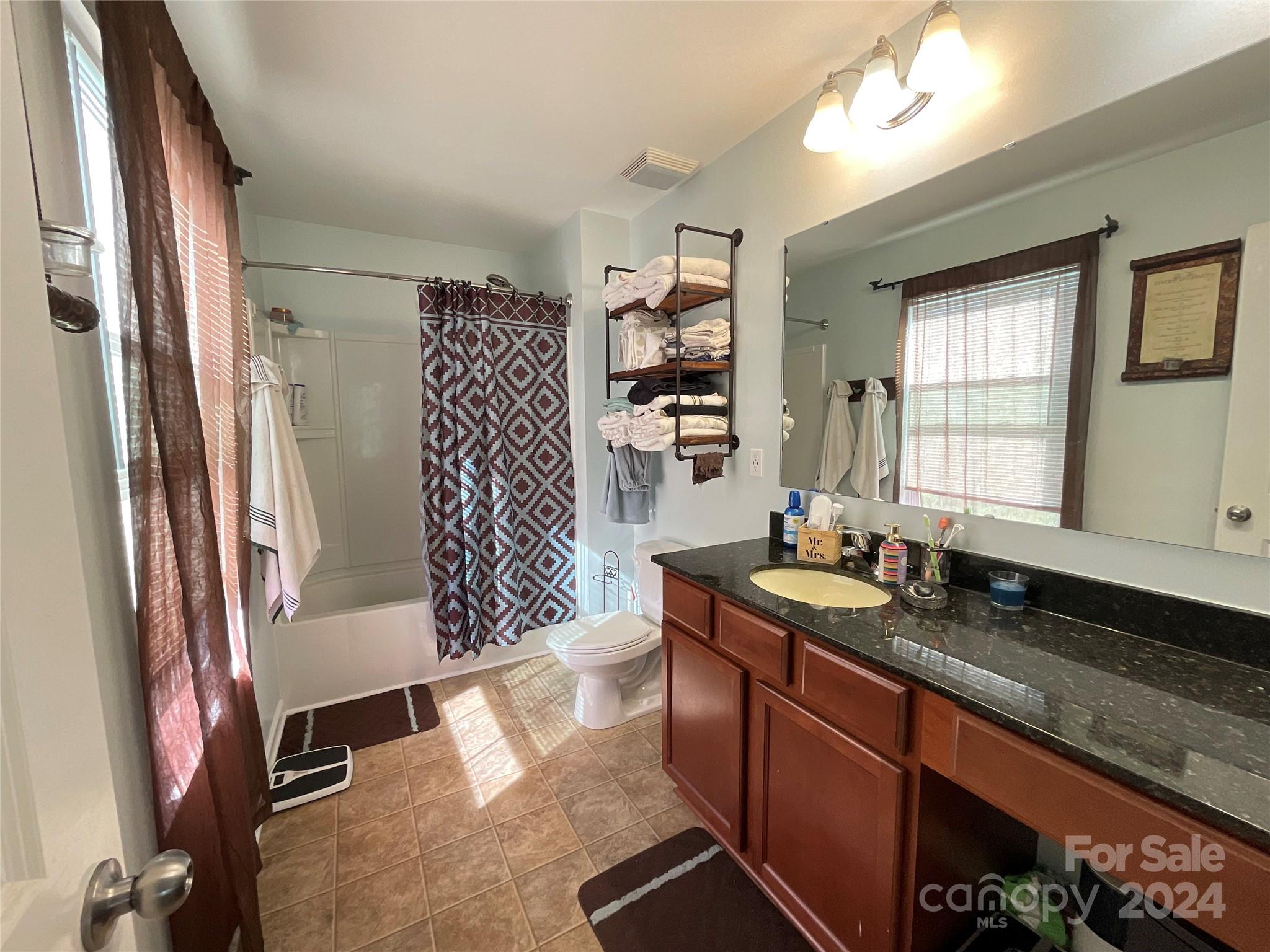 3271 Brickwood Circle Midland, NC 28107 - Photo 15 of 20 a kitchen with granite countertop a sink stove and refrigerator