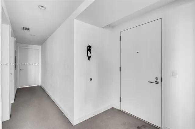 a bedroom with furniture and a flat screen tv