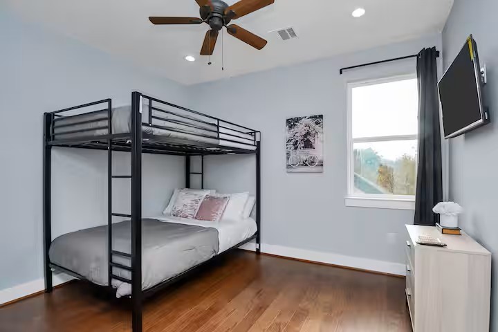 3412 Dixie Drive Houston, TX 77021 - Photo 15 of 15 a bedroom with a bed and a flat screen tv