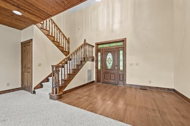 a view of a livingroom with a ceiling fan and window
