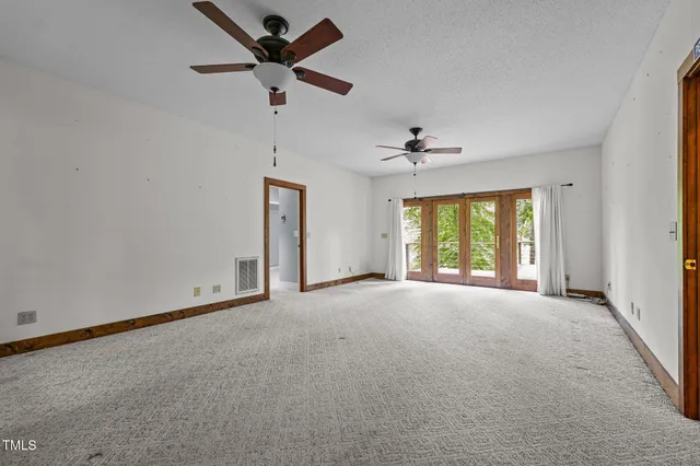 a view of an empty room with empty shelves