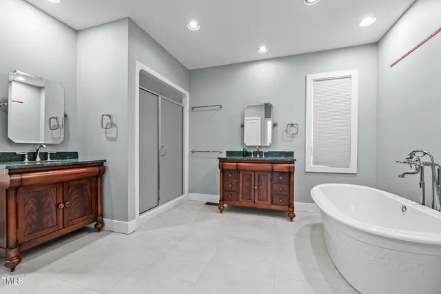 a kitchen with stainless steel appliances granite countertop a stove sink and cabinets