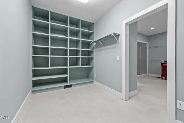 a bathroom with a sink a mirror and a window