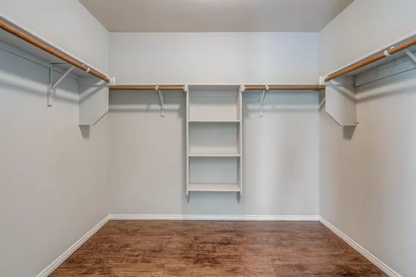 a view of an empty walk in closet