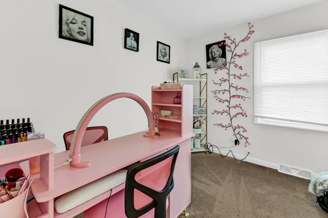 a view of a livingroom with furniture and cabinet