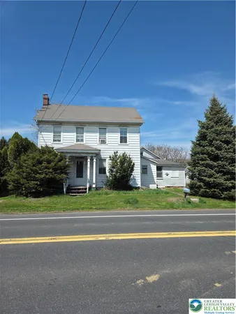 a view of a house and a street
