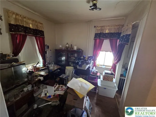 a bed room with a bed and a lamp
