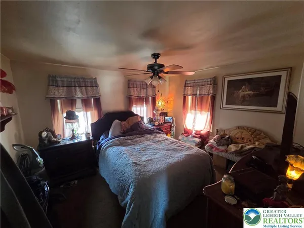a bed room with a bed furniture and a window