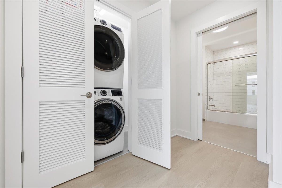 303 Madison Street, Unit 406 Hoboken, NJ 07030 - Photo 13 of 29 a utility room with dryer and washer