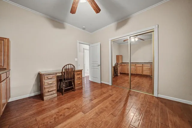 a bathroom with a sink a toilet a mirror and shower