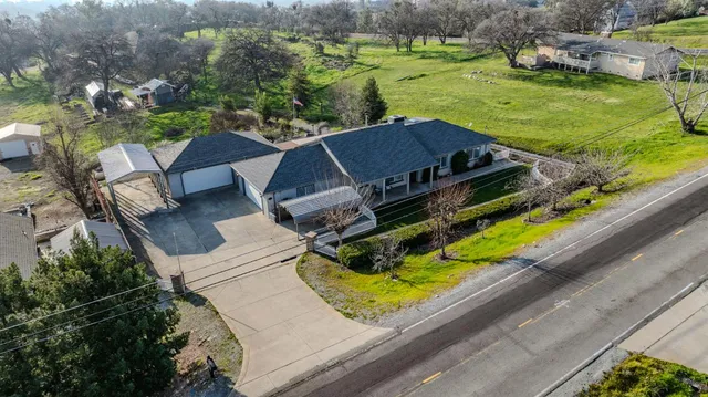 an aerial view of a house with a garden