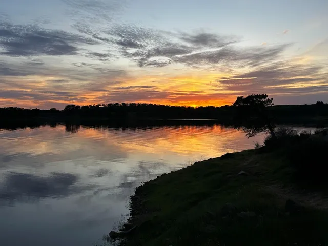 a view of lake with green space