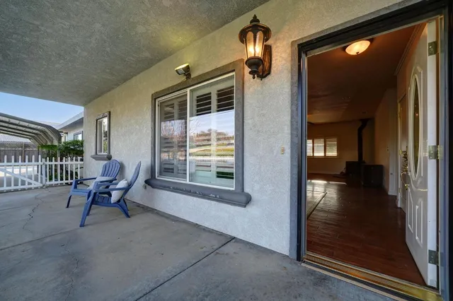 a view of a hallway with seating area