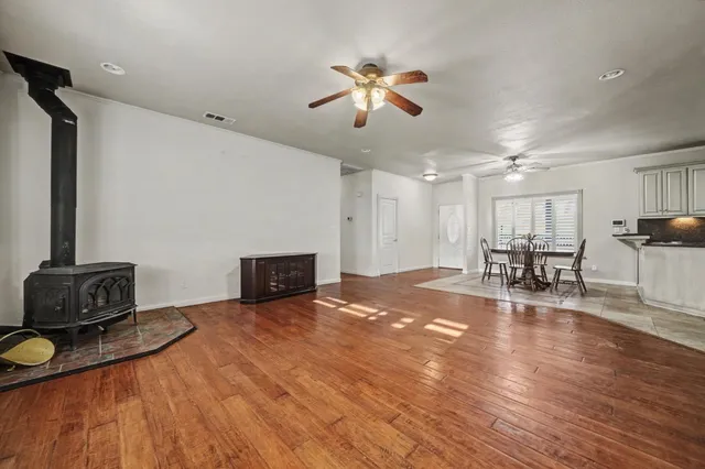 a view of a livingroom with furniture and a flat screen tv