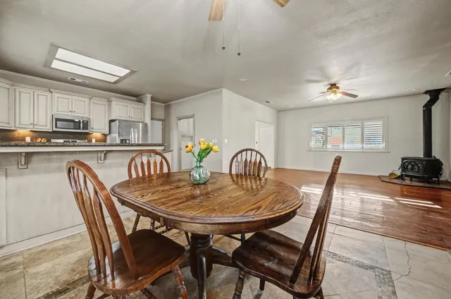 a dining room with furniture and window