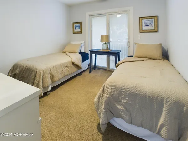 a bedroom with a bed and lamp