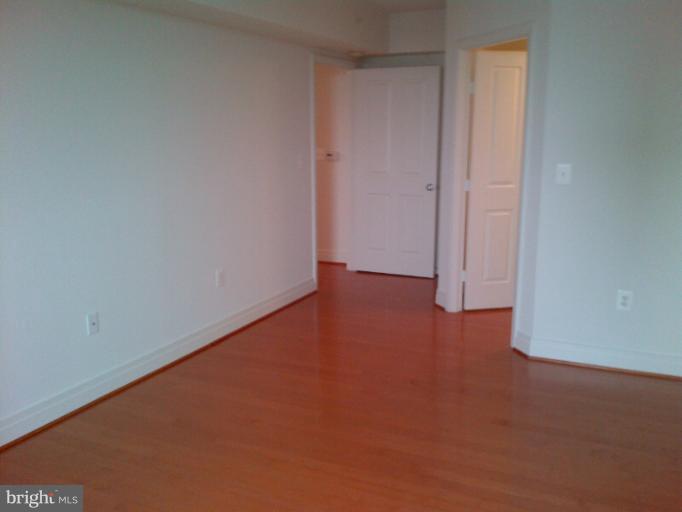 414 Water Street, Unit 1901 Baltimore, MD 21202 - Photo 12 of 17 Owners Bedroom with Hardwood