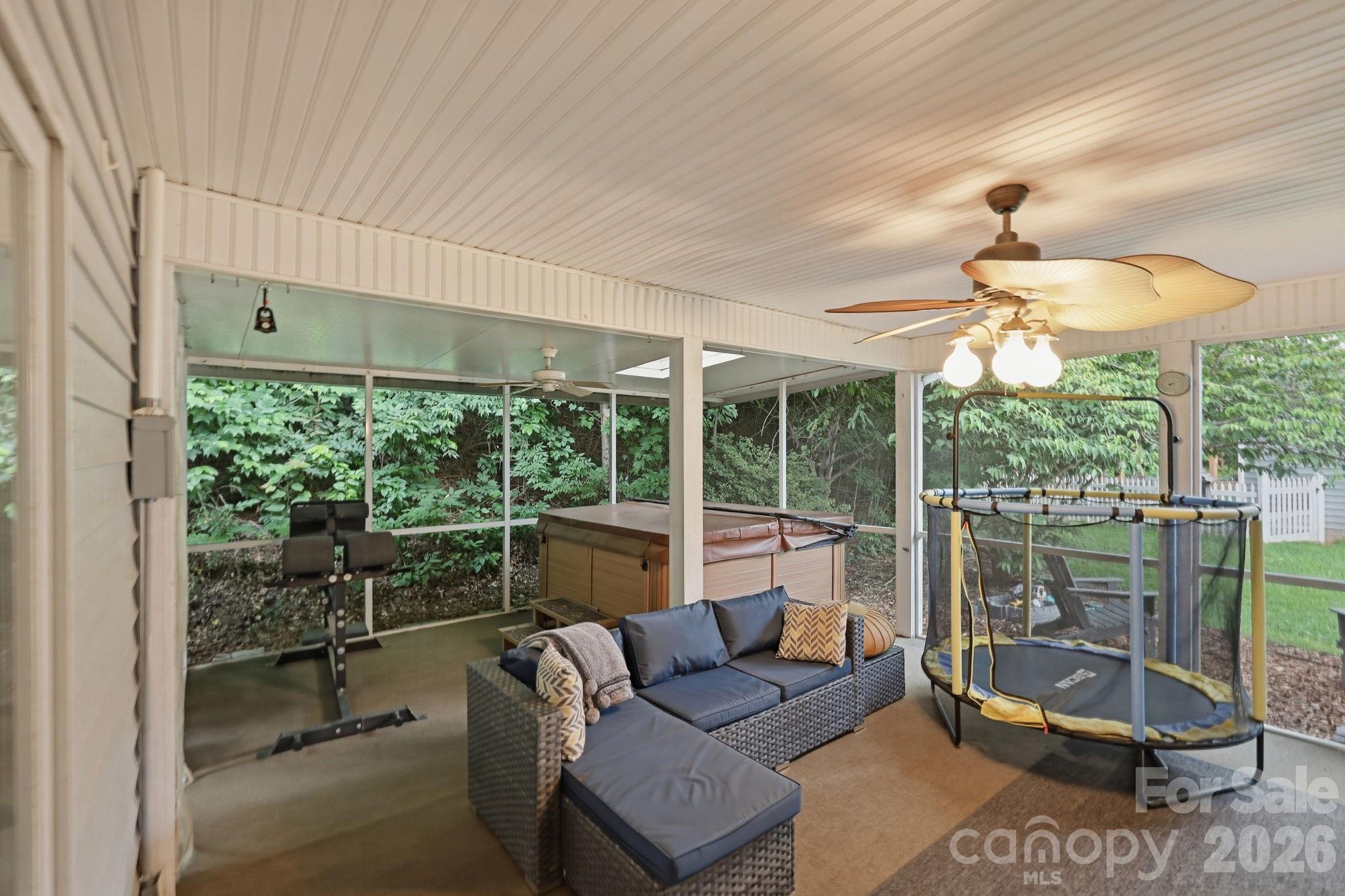 51 Sunview Circle Arden, NC 28704 - Photo 21 of 31 a living room with furniture and a floor to ceiling window