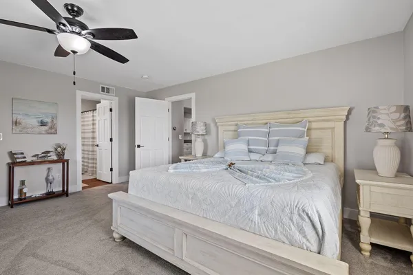 a living room with furniture and white walls