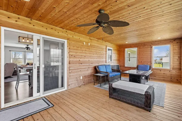 a front view of a house with a garden and trees