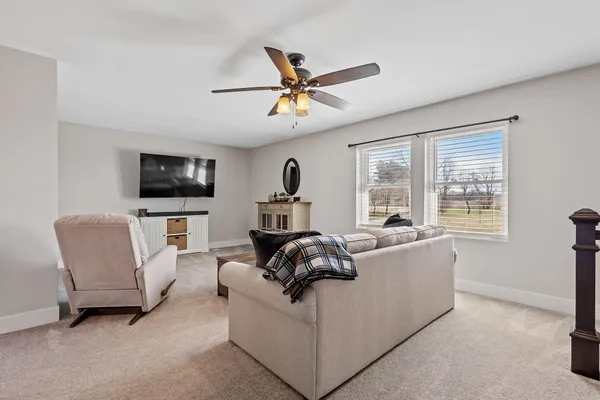 a front view of house with yard and trees