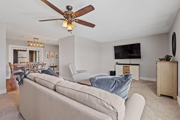 a front view of a house with a garden and yard