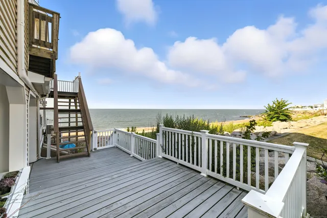 a view of a balcony with wooden floor