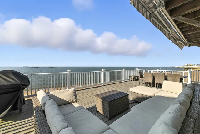 a balcony with furniture and city view
