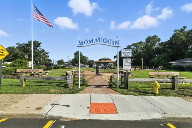 a view of a park with sitting area