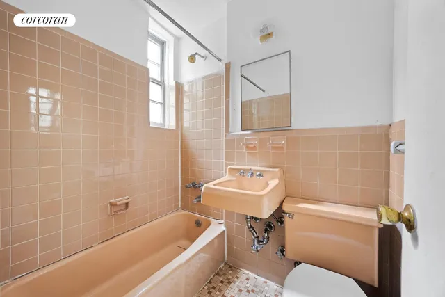a kitchen with a stove and white cabinets