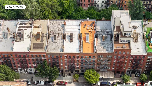 an aerial view of a city with tall buildings