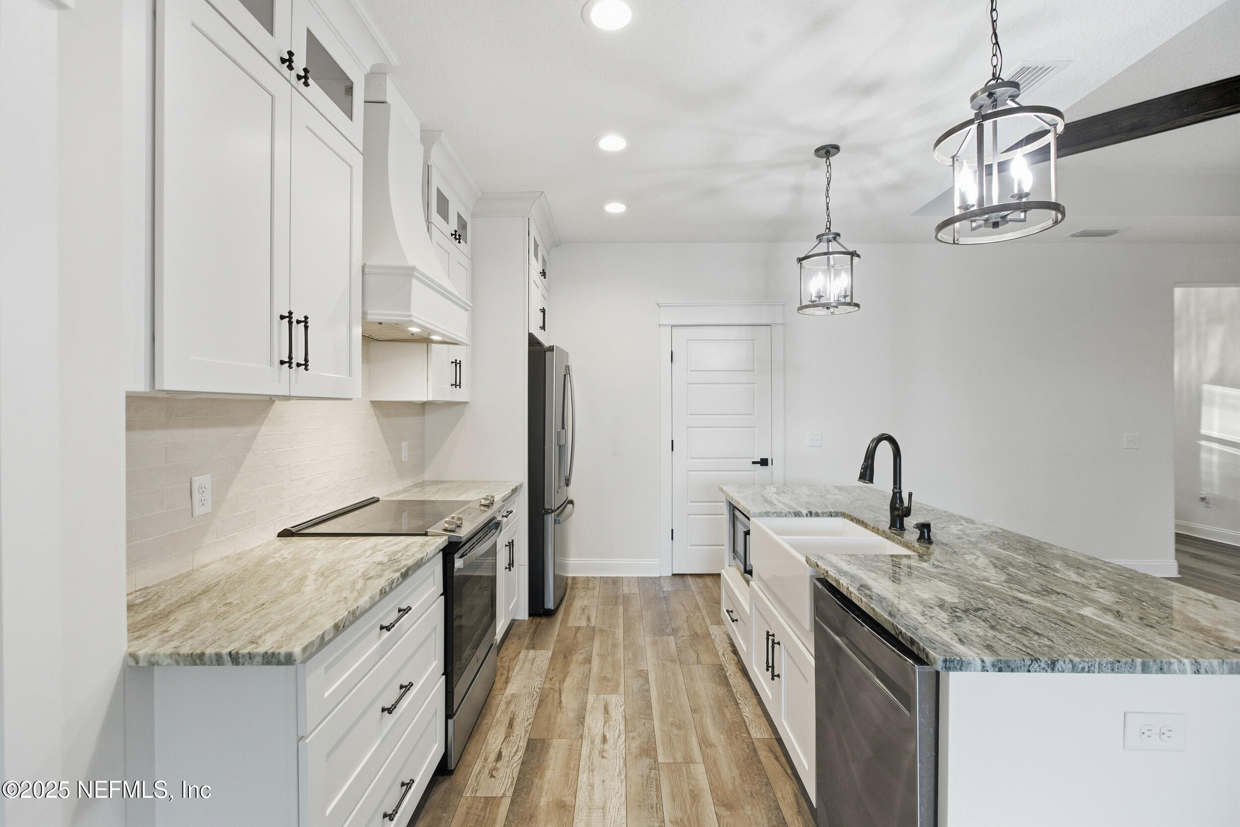 128 Santa Rosa Street Florahome, FL 32140 - Photo 17 of 57 a kitchen with a sink stove and refrigerator