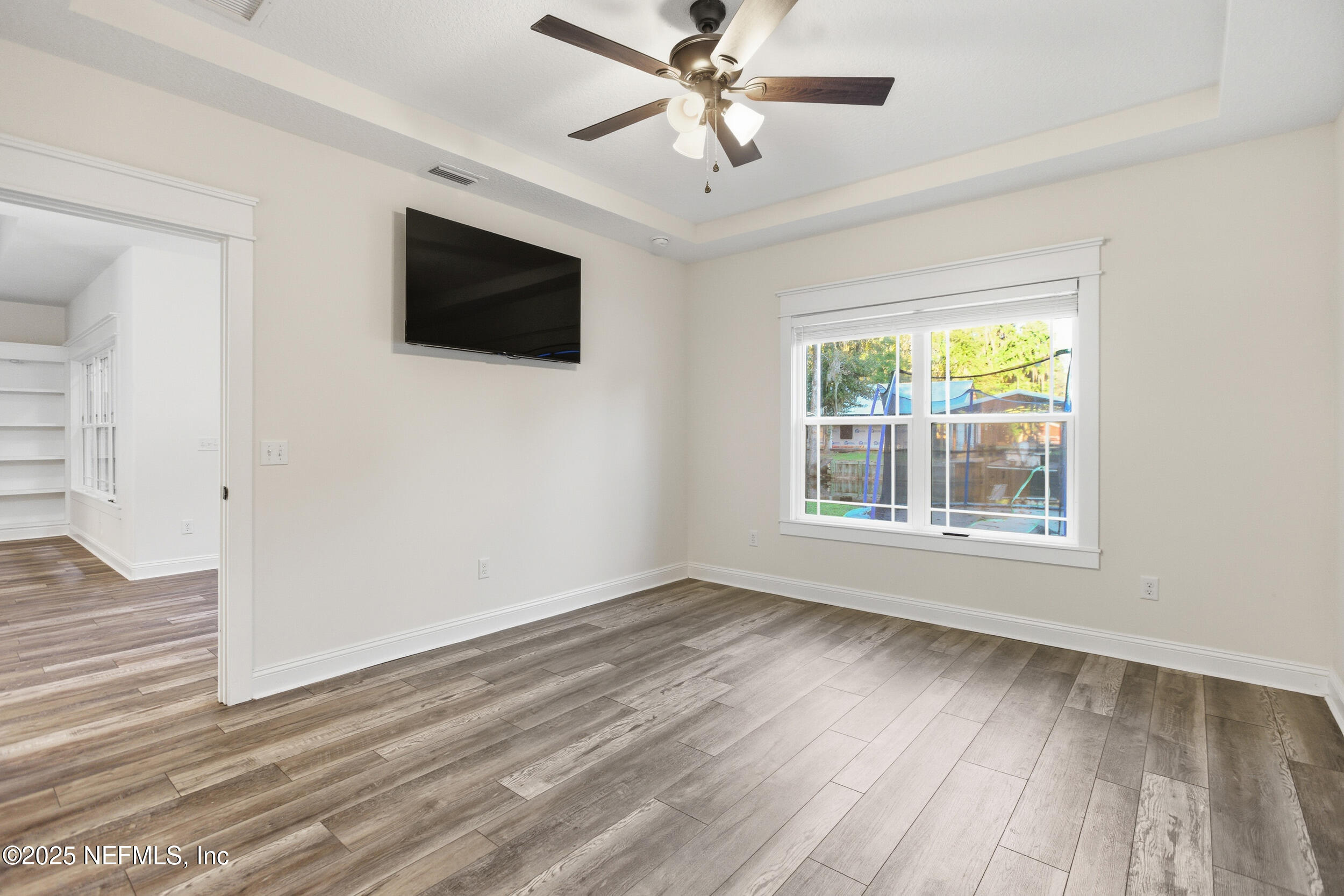 128 Santa Rosa Street Florahome, FL 32140 - Photo 27 of 57 a view of livingroom with hardwood floor and ceiling fan