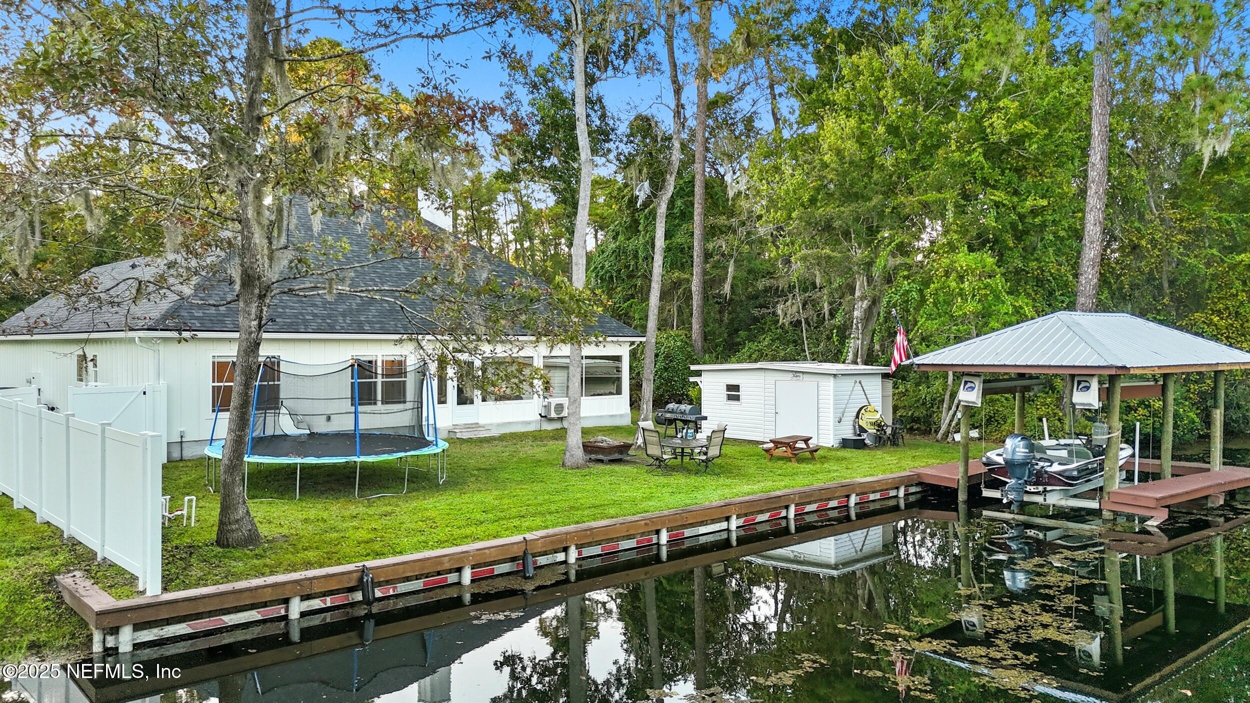 128 Santa Rosa Street Florahome, FL 32140 - Photo 47 of 57 a garden view with a seating space