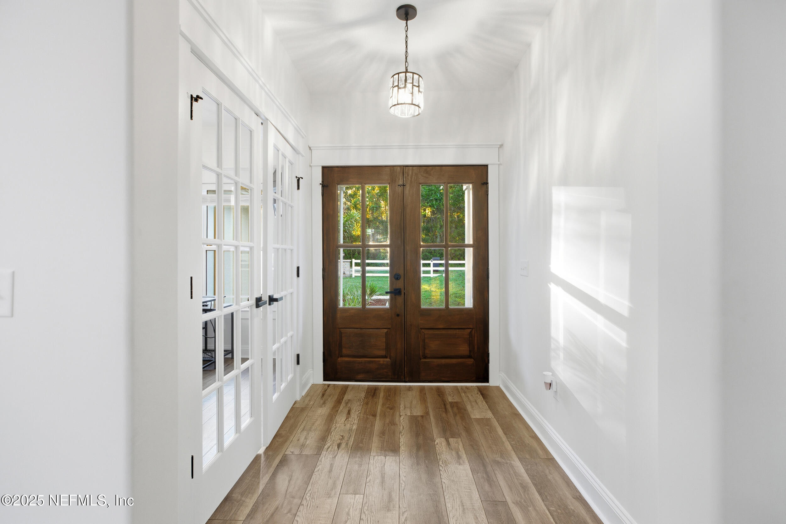128 Santa Rosa Street Florahome, FL 32140 - Photo 5 of 57 a view of a hallway view with wooden floor and staircase