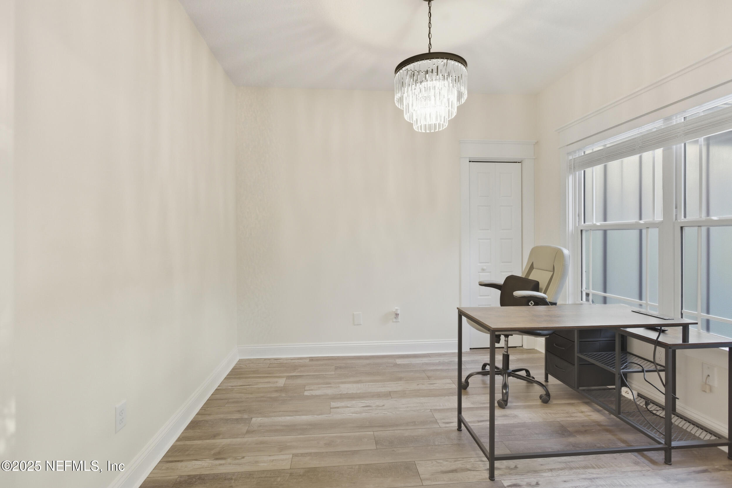 128 Santa Rosa Street Florahome, FL 32140 - Photo 7 of 57 a workspace with wooden floor and a window