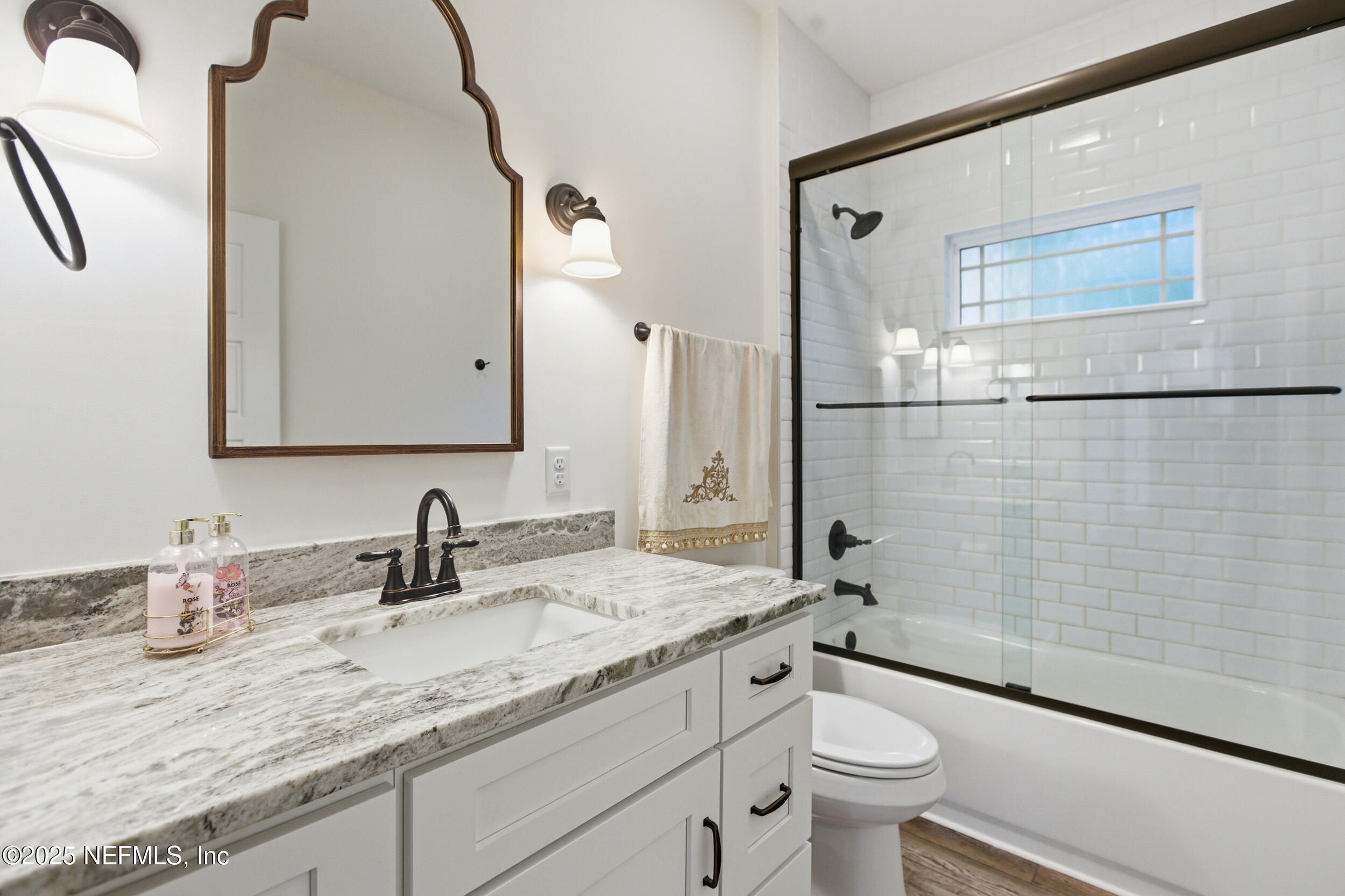 128 Santa Rosa Street Florahome, FL 32140 - Photo 8 of 57 a bathroom with a granite countertop sink toilet and shower