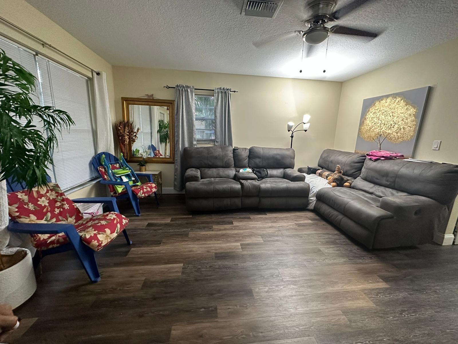 523 Colonial Road, Unit A B West Palm Beach, FL 33405 - Photo 2 of 11 a living room with furniture and a window