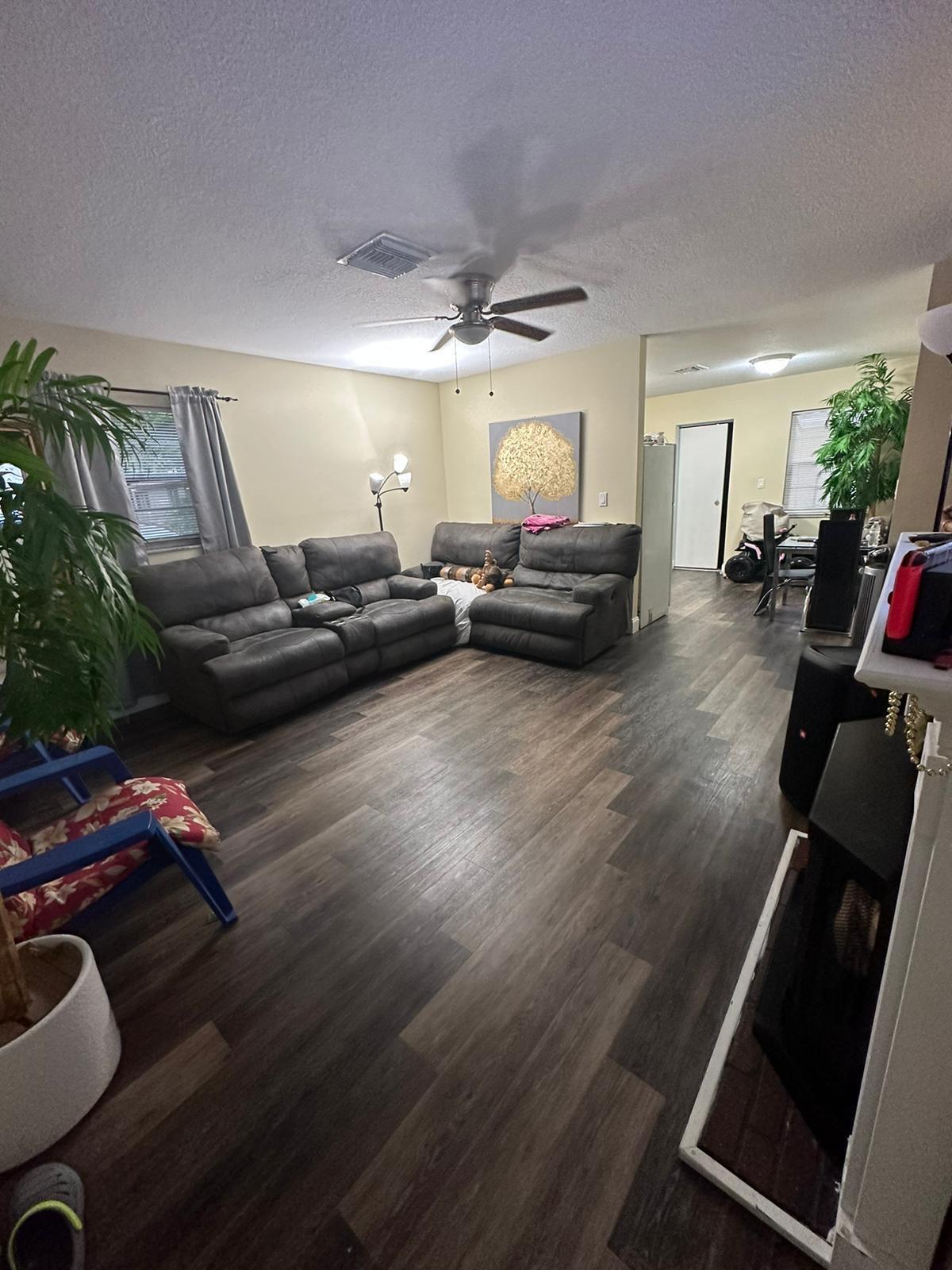 523 Colonial Road, Unit A B West Palm Beach, FL 33405 - Photo 3 of 11 a living room with furniture and a wooden floor